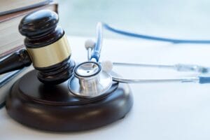 Gavel and stethoscope. medical jurisprudence. legal definition of medical malpractice.